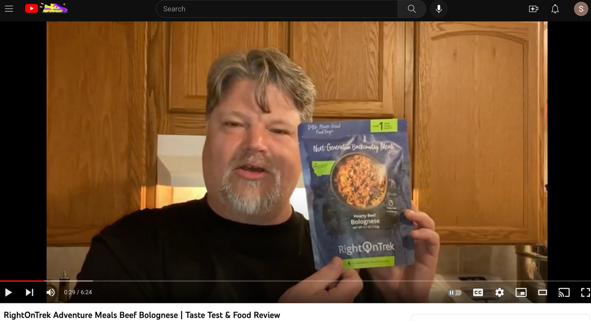screenshot of youtube review "Keithtube" holding RightOnTrek Beef Bolognese