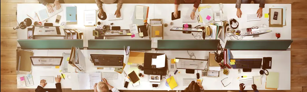 office workers sitting at conference table