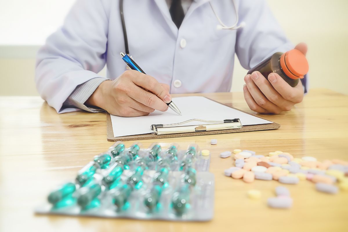 Pharmacist writing down prescriptions covered by Medicare