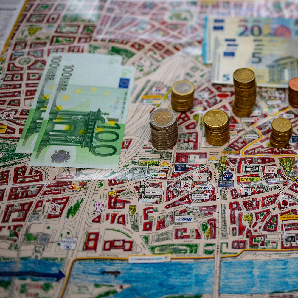 Denomination banknotes and coins.webp