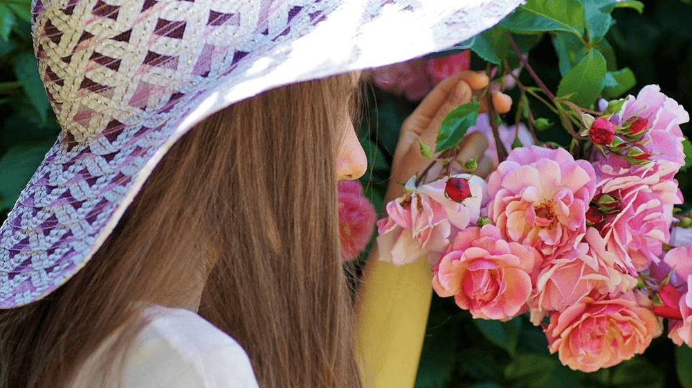 Woman smelling roses