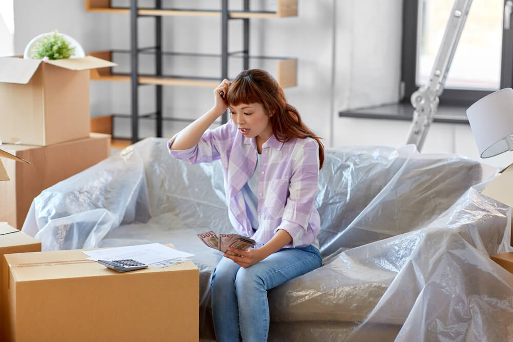 Woman wondering how she will pay moving costs