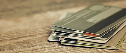 a stack of credit cards on a table