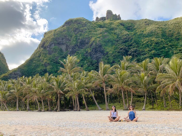 Empty white sand beach in Batanes with cousin