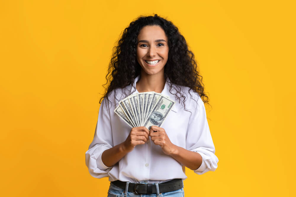 happy woman with fast payday loan cash