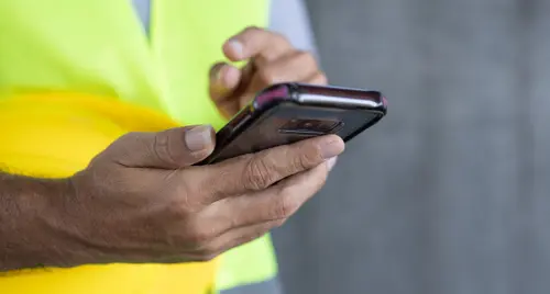 construction worker holding a phone with a good case