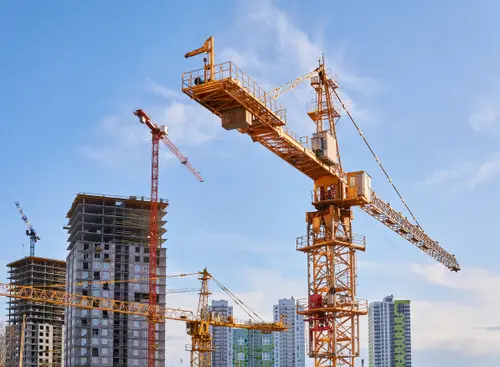 Cranes in city with buildings being constructed
