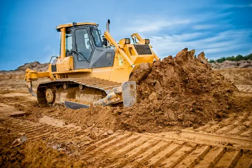 Bulldozer pushing dirt on jobsite