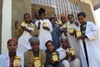 Multiple people holding jars