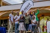 Light for the World Team, Disability Inclusion Facilitators, and member of partner organizations smiling and celebrating  to camera with Light for the World banner behind them