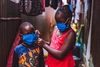 Two children wearing face masks in Kenya in 2020.