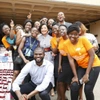 A large group of people smiling at the camera.