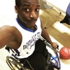 Munya in his wheelchair playing ball