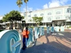 Jemila Abdulai in front of a Cape Town sign