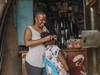 Natasha Nongo braiding hair, a participant in the The Regional Gender Program – Accelerating Impact for Young Women in Africa (AIM)