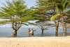 A group of people by water outdoors