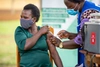 A person receiving a vaccine injection