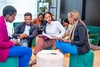 A group of young people seated having a discussion at the Day 1 of the baobab Summit 2025