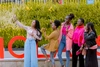 A group of young women taking a group photo outdoors at the Baobab Summit 2022