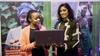 Two women stood looking at a laptop