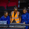 A group of women working with technical equipment in a stage setting for TAFTA Nigeria, 2024