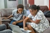 Two students learning on a computer.