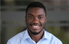 Charles Mankhwazi in a pale blue shirt smiling to camera