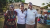 Lucy Aciro with her mother and father standing outdoors
