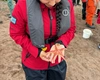 A woman holding a starfish.