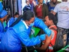 A man receiving vaccination in DRC.