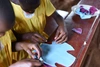 AWA staff lead a session on how to make menstrual pads at Kiyagi Parents Primary School near Jinja, Uganda. 