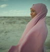 Woman standing in the sand