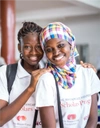 Two young women Scholars smiling.