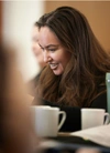 An Indigenous woman in a coffee shop.