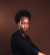 Caessy Ngarambe wearing a black blazer with black top