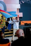 Flag ceremony at Baobab Summit 2022, student waves a large flag to represent their country