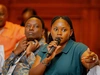 A young woman, wearing a dark green short sleeve blouse, speaking into a microphone at the Community Heath Workforce Program convening in Addis Ababa Ethiopia, February 26-27, 2026.