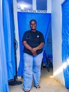 Victoria standing in front of multiple private rooms where healthcare practitioners administer medications to her clients at her healthcare clinic.