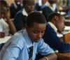 A class of boys working in their school books.