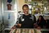 Young woman smiling showing some printed designs