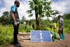 Nelson working on solar panels with his team