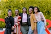 Group of women stood together smiling to camera