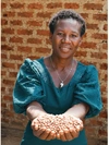 Maclane Natukunda, Chairperson of the Katibani Youth Farmers Group showing off a sample of the group’s cultivated bean seed, participant in the NSSF Hi-Innovator Program in Uganda.
