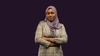 Adja Boudy Kanté in a lilac coloured head scarf and light beige blazer