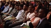 A group of young people smiling in an auditorium for the 2018 Baobab Summit, 16 x 9