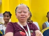 Bernice Yawo Agboada Founder Vijay's Mushrooms at a conference wearing a maroon coloured tshirt