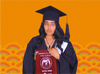 Roza Abrham in cap and gown holding her class of 2024 University of Gondor diploma