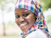 A young woman smiling at the camera.