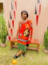 Phiwayinkhosi Precious Lukhele (Phiwa) in a traditional red, green, black and white patterned dress