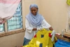 Pang Ismail, speaking with a client in Kakuma refugee camp, 2026.